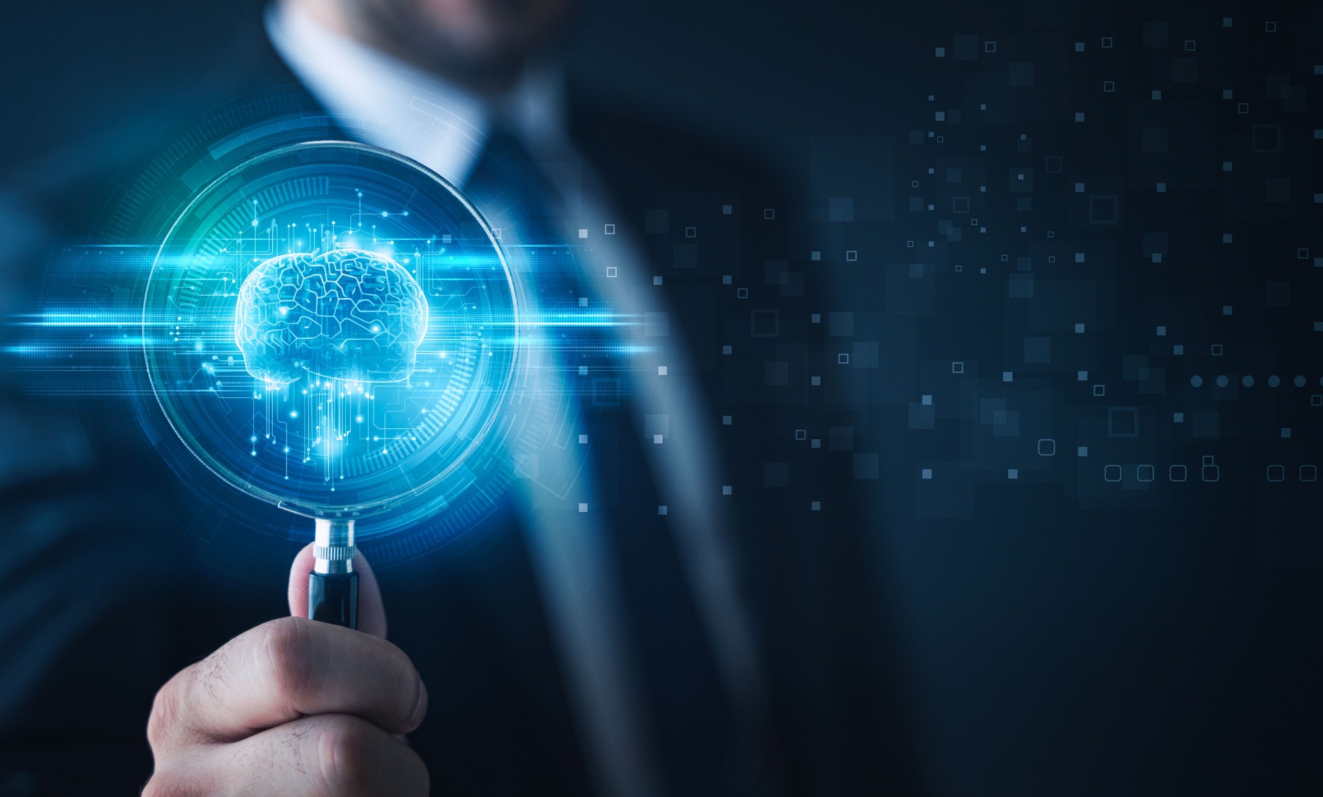 Businessman holding magnifying glass and digital brain