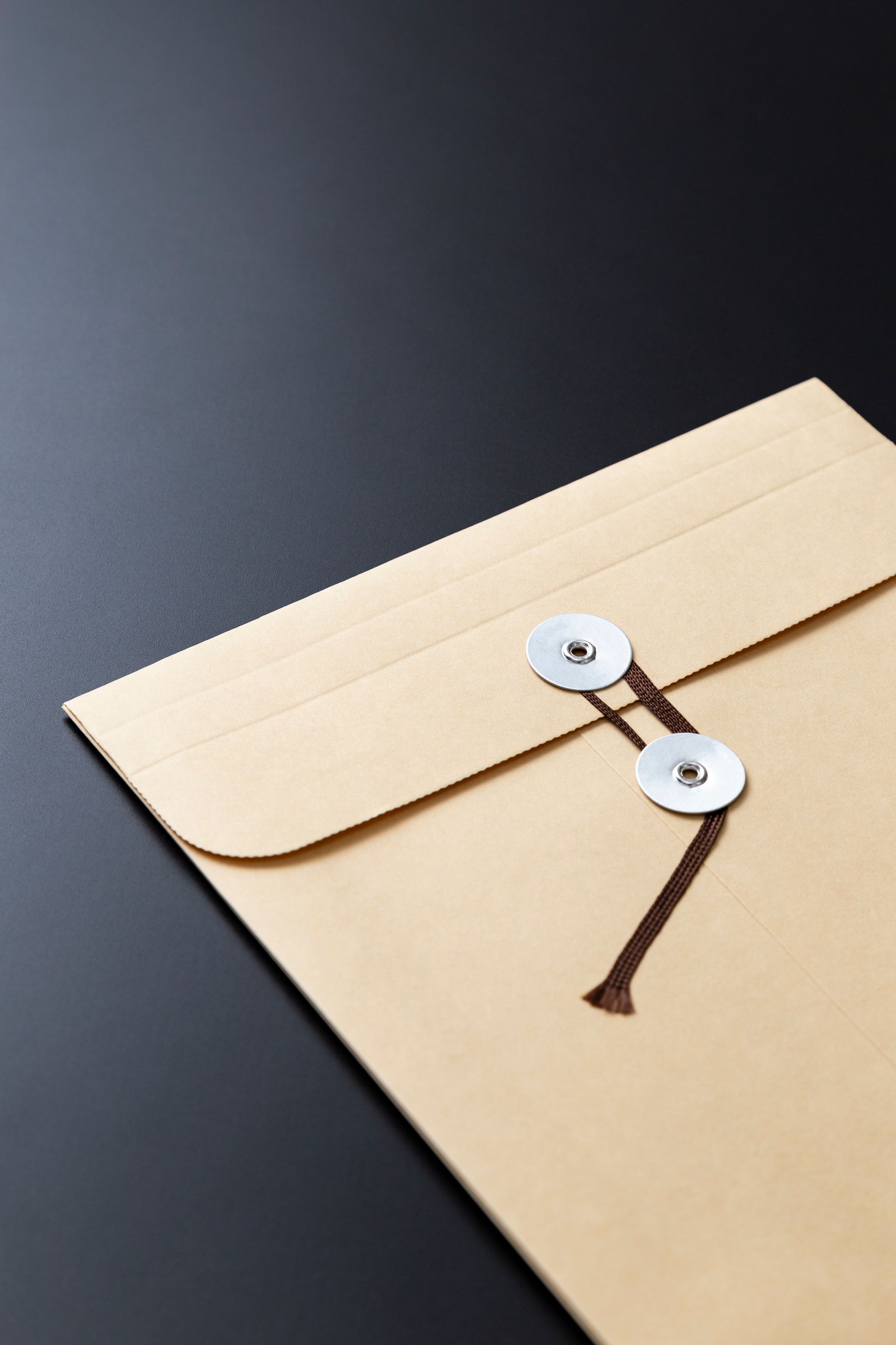 Envelope containing important documents on a black background